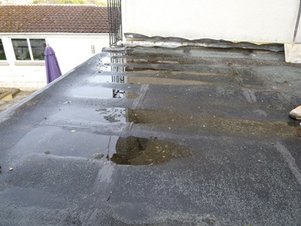 Ponding on a Flat Roof Central VA Roofing Contractor